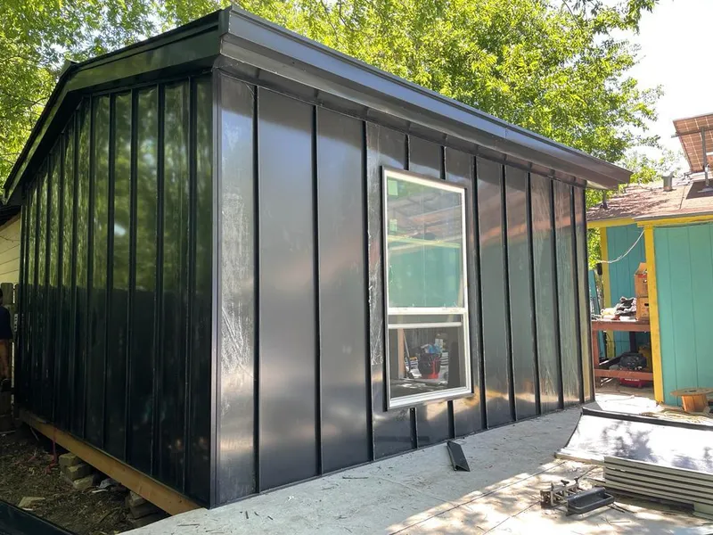 Black standing seam metal wall panels for Roof Inspection in Egelston